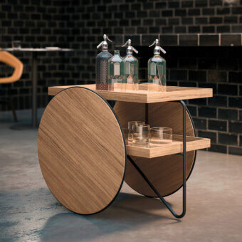 Exceptional Casamania Chariot bar cart crafted in Italy with curved lines and a black metal structure alongside rectangular wooden shelves