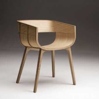 Refined Casamania Maritime armchair built in solid oak with smooth matte finish and curved flowing design