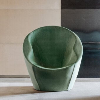Distinguished Casamania Ouch lounge chair presents ergonomic form with muted green textile upholstery and matte finish