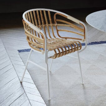 Superior Casamania Raphia armchair with woven rattan and matte white metal frame crafted in Italy