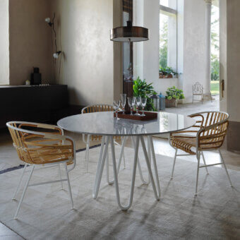 Distinguished Casamania Raphia armchair with curved woven raphia and sleek matte white metal frame