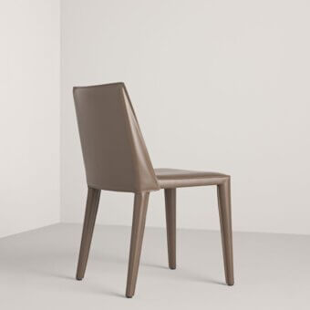 Distinguished Frag Dindi chair fully upholstered in smooth saddle leather with a flexible spring steel back