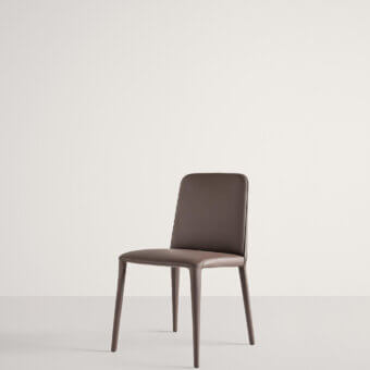 Captivating Frag Elf chair with supple leather upholstery, tapered lines and a matte finish in a muted brown tone