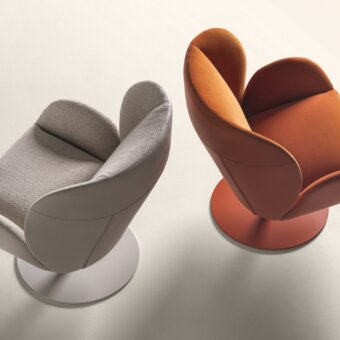 Elegant Frag Ocean lounge chair with orange textile upholstery and smooth finish built upon a circular swivel base