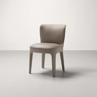 Elegant Frag Public chair with continuous flowing silhouette upholstered in smooth matte taupe leather or fabric
