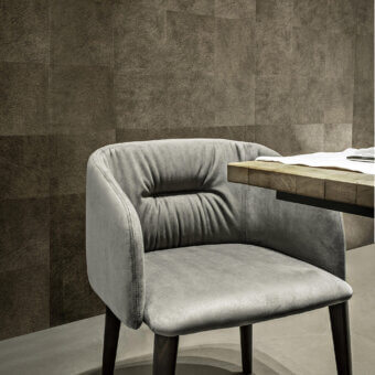 Exceptional Frag Sofy armchair upholstered in soft matte gray textile with walnut-tinted Ash wood legs crafted in Italy