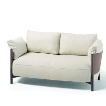Superior Frag Syren sofa embodies comfort with light beige textile upholstery and brown leather panels built with dark metal legs