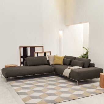 Distinguished Horm Dizzy sectional with dark grayish-brown textile upholstery and slender aluminum frame showcasing Italian tailoring craftsmanship