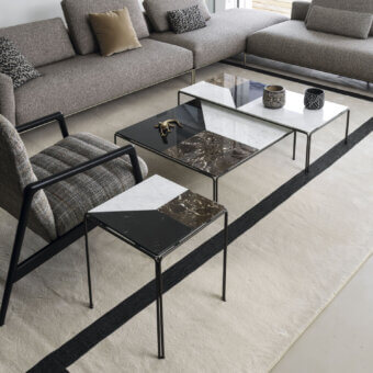Distinguished Horm Ragtime tables with angular silhouettes and Carrara, Emperador, Marquina marble tops in glossy finish with matte black bronze painted metal bases