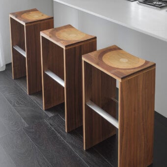 Distinguished Horm Ripples stool with saddle seat crafted in laminated composite walnut, mahogany, cherry, oak and ash with hand-finished details