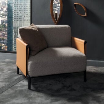 Distinguished Horm SC2 lounge chair with black painted tubular cage, Canaletto walnut details and supple tan leather armrests