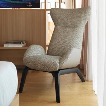 Superior Horm Soho lounge chair with light beige patterned fabric upholstery and dark-stained wood legs
