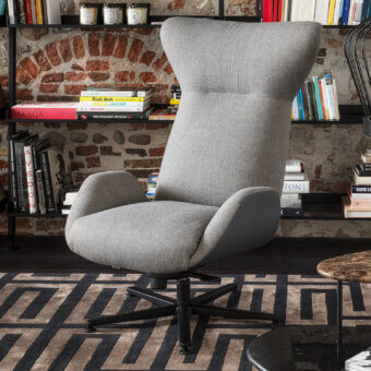 Exceptional Horm Soho lounge chair with enveloping light gray textured fabric and dark smooth synthetic accents built on a black swivel base