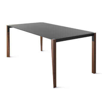 Distinctive Horm Tango extendable table with a dark gray Fenix tabletop and dark metal frame built with dancing wooden legs in a dark brown finish