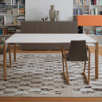 Distinguished Horm Tango table crafted in Italy with a matte white Fenix tabletop and light tone wooden legs