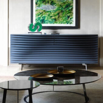 Captivating Horm Tide sideboard built with sculpted MDF sheets in a uniform muted blue and satin metallic legs