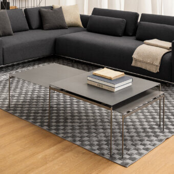 Exceptional Horm Torii coffee table crafted with dark gray hard metal and ceramic in a minimalist two-tiered structure with unvarnished finish