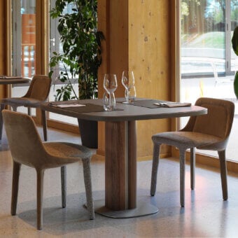Elegant Horm Trafalgar table with Fenix top and wooden base featuring metallic inserts in a matte finish