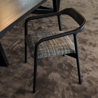 Distinguished Horm Velasca armchair crafted in solid ash with a dark matte finish and woven gray, brown, white seat cushion
