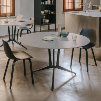 Superior Lapalma Trail table with round light gray concrete-like top and black powder-coated die-cast aluminum base