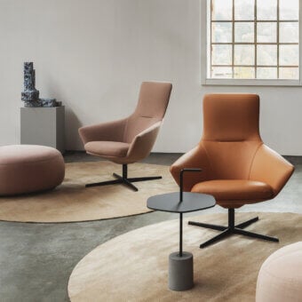 Superior Lapalma Wing Tip lounge chair with warm medium-brown leather upholstery and powder-coated aluminum swivel base