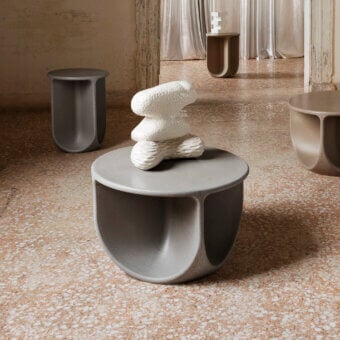 Captivating Miniforms Pinto coffee table crafted in matte gray with distinctive U-shaped cutouts and a smooth circular tabletop