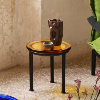 Exceptional Miniforms Zigo side table with rippling amber cast glass and matte black metal legs