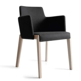 Distinguished Bross Bridget armchair with light-toned wood legs and dark textile upholstery exhibiting a minimalist aesthetic