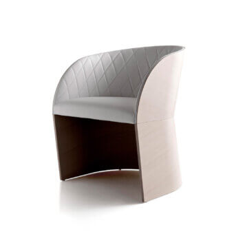 Distinguished Bross Hug armchair with gray premium fabric upholstery, quilted detailing and a light-colored wood base crafted in Italy