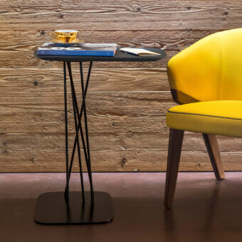 Superior Bross Mika side table with a square oak stained surface and bundle of slender black lacquered metal rods