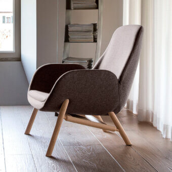 Exceptional Bross Mysa lounge chair crafted in Italy with muted brown fabric upholstery and angled wood base