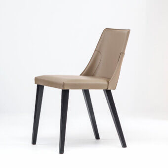 Superior Bross Ned chair upholstered in light tan leather with sleek dark-stained wooden legs crafted in Italy