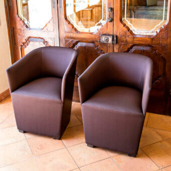 Sophisticated Bross Nest Lounge chair with reddish-brown fabric upholstery and a smooth matte finish built with a wood base
