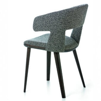Superior Bross Path armchair with speckled black and white textile upholstery and dark-toned wood frame