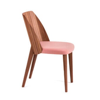 Lavish Bross Shell chair with embracing shape, soft pink fabric seat and medium-toned wood legs crafted with visible grain