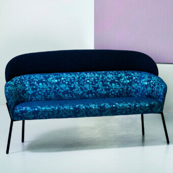 Superior Bross Wam sofa with patterned blue textile upholstery and sleek dark navy metal frame finish