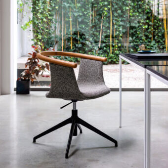 Distinctive Bross Yuumi swivel armchair with gray speckled fabric upholstery and curved ashwood complemented by a black metal base