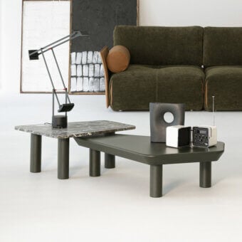 Captivating Cierre1972 Iceberg coffee table with overlapping marble-patterned top and dark gray cylindrical legs in matte finish