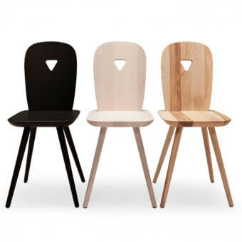 Distinguished Casamania La Dina chair crafted from wood with a light natural finish and rounded lines