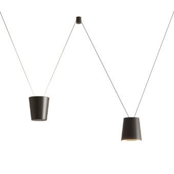 Elegant Kundalini Sling suspension lamp with die-casted aluminum and a dark finish illuminating spaces with warm geometries