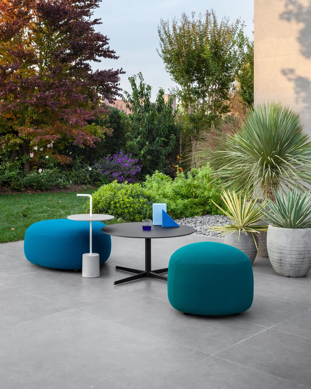Exceptional Lapalma Kipu Outdoor ottoman with rounded triangular form crafted in teal water-resistant outdoor fabric with smooth matte finish