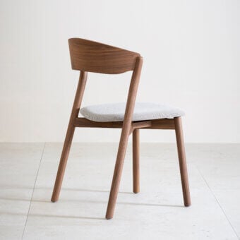 Elegant Miniforms Tube chair with light gray upholstery and smooth medium-toned brown wood frame crafted in Italy