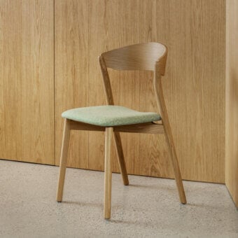 Distinguished Miniforms Tube chair with light green upholstery and smooth light-toned wooden frame crafted in Italy