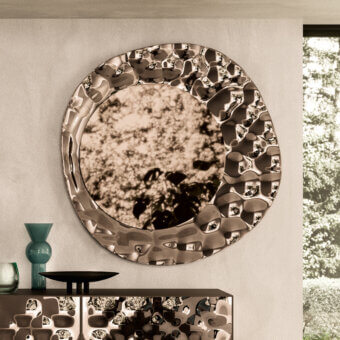 Distinguished Ozzio Italia Sea mirror with curved glass and reflective light-toned metallic undulating frame crafted in Italy