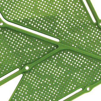 Perforated plastic panel, light green, stylized Monstera leaf design with circular holes and raised vein sections, matte finish.