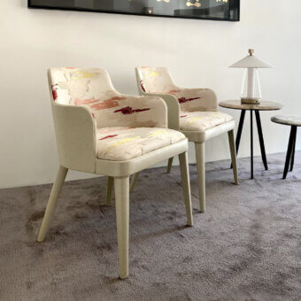Distinguished Casa Casati Lola Royale chair crafted with beech wood and off-white leather, upholstered in patterned fabric with red, yellow, grey tones and a matte finish