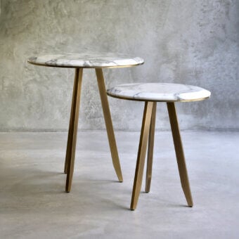 Distinguished Casa Casati Mirage side table with marble top and thin matte gold metal legs crafted in Italy