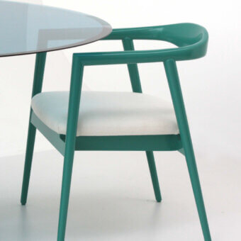 Refined Casa Casati Romy armchair with natural ash wood legs and glossy green lacquer, built with a comfortable white textile seat