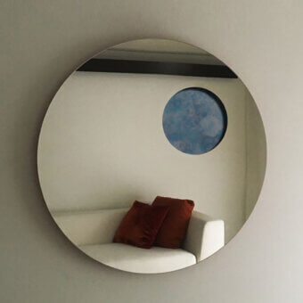 Captivating Casa Casati Transito mirror with lacquered MDF, a blue sky cut-out, and a matt orange lacquered back panel