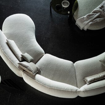 Elegant Cierre1972 Seed sectional with light textile upholstery and curved organic form crafted in Italy